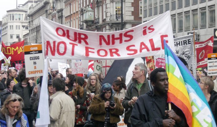 ‘The NHS is not for sale’ – trade unionists with a clear message in London on March 26 this year. They will march again today against the Health Bill