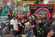 RMT rail union members marching against government cuts and in defence of jobs