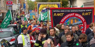 RMT rail union members marching against government cuts and in defence of jobs