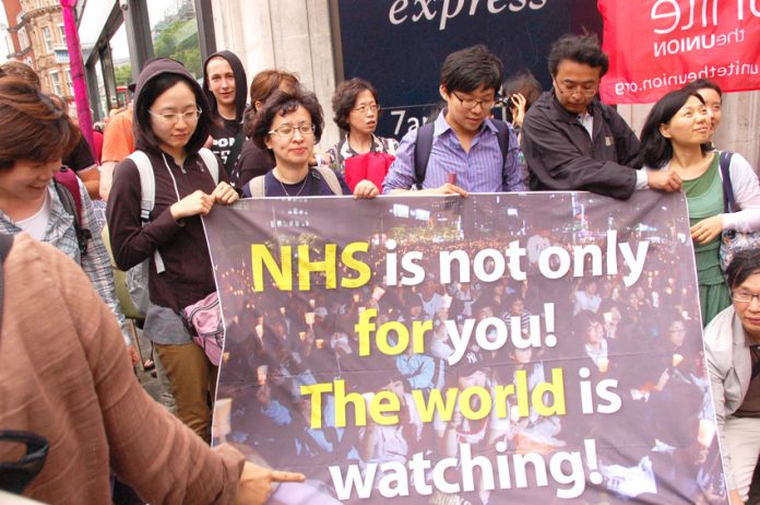 Korean health advocates took part in the march with their banner to show that the defence of the NHS is not just a national issue