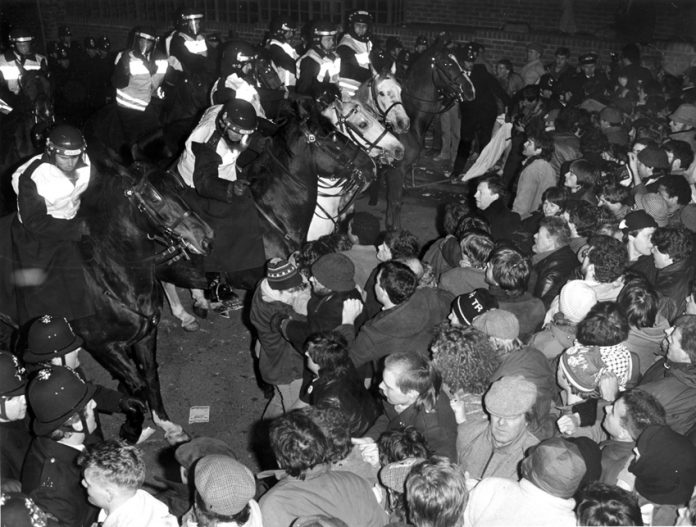 Mounted police charge at sacked printers marching to News International’s Wapping Fortress during the 1986-87 printers struggle for jobs and union rights