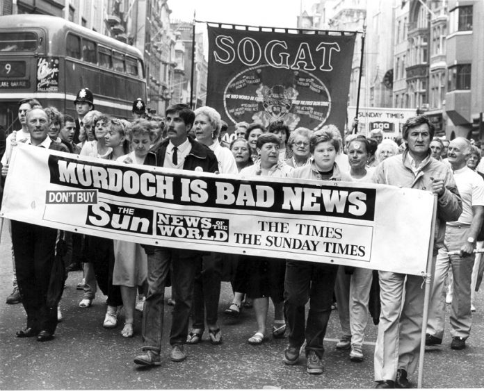 Sacked News International print workers marching in Fleet Street with a defiant message during their bitter 1986-87 strike