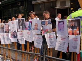 On a demonstration in London, protesters display the names of the victims killed in the attack by Israeli soldiers on the peace flotilla last year