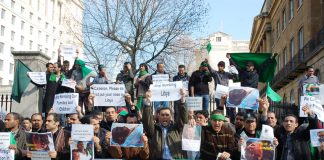 Libyan students and workers picketing Downing Street demanding the coalition stop the bombing of the Libyan people