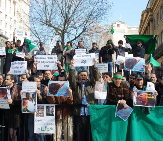 Libyan students and workers picketing Downing Street demanding the coalition stop the bombing of the Libyan people