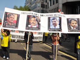 Tamils marching on May Day in London condemn Sri Lankan President Rajapaksa and his brother as war criminals