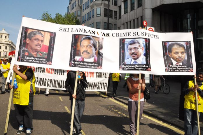 Tamils marching on May Day in London condemn Sri Lankan President Rajapaksa and his brother as war criminals