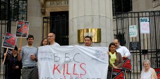 The picket line at Bush House. Howard Zhang (centre) told News Line ‘They are forcing people out who don’t want to go.’