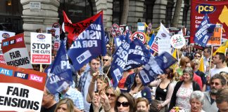 Members of ATL, NUT, UCU and PCS marching in London during their national strike action to defend pensions on June 30