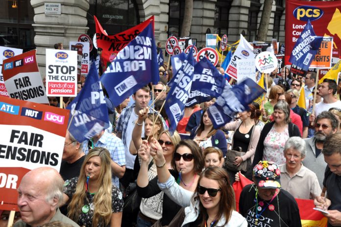 Members of ATL, NUT, UCU and PCS marching in London during their national strike action to defend pensions on June 30