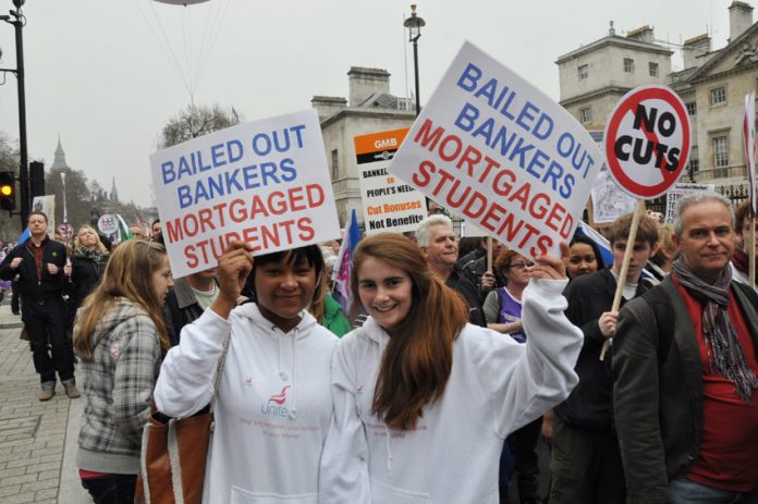 Students demonstrate against bail-outs for bankers while they are told to pay £9,000 a year tuition fees