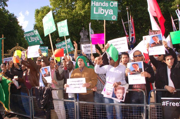 Libyan students demonstrate against the NATO bombing of Tripoli during US President Obama’s visit to Buckingham Palace in May