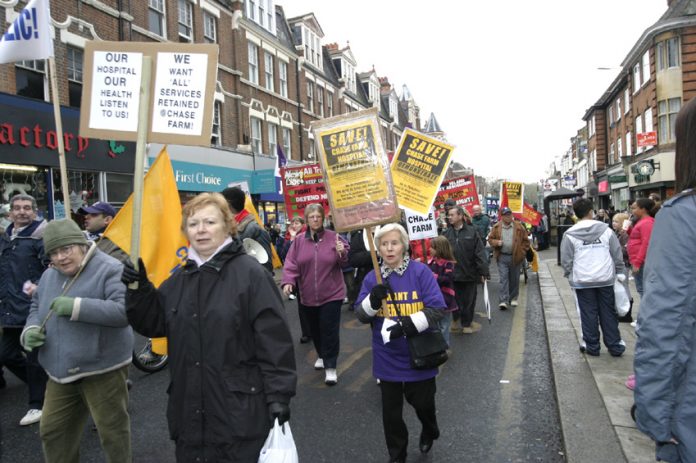 Demonstrators have taken to the streets of Enfield in their thousands to defend Chase Farm Hospital against closure