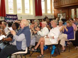 Members of the audience applauding a speaker at the conference, which voted for an occupation