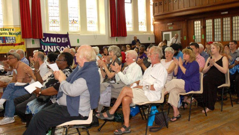 Members of the audience applauding a speaker at the conference, which voted for an occupation