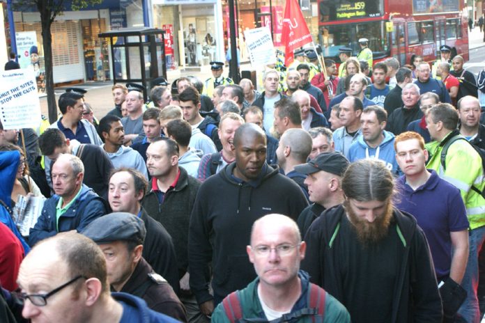 Construction workers rallying in Oxford Street yesterday morning in defence of jobs, pay and working conditions in the industry