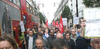 Construction workers march down Oxford Street on Wednesday morning