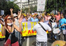 A joyful municipal workers contingent – placard reads: ‘Down with the junta of PASOK’