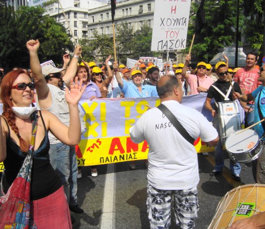 A joyful municipal workers contingent – placard reads: ‘Down with the junta of PASOK’