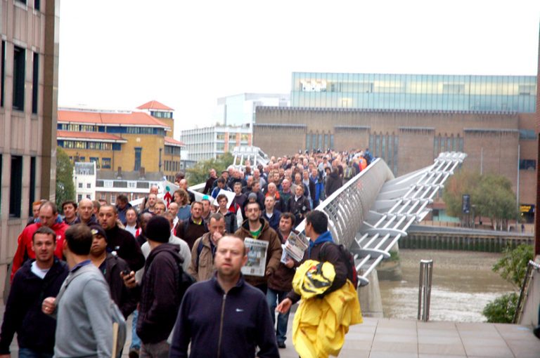 Construction workers marching to the City of London from Tate Modern