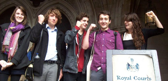 Callum Hurley and Katy Moore and supporters challenging the government over tuition fee rises yesterday at the High Court