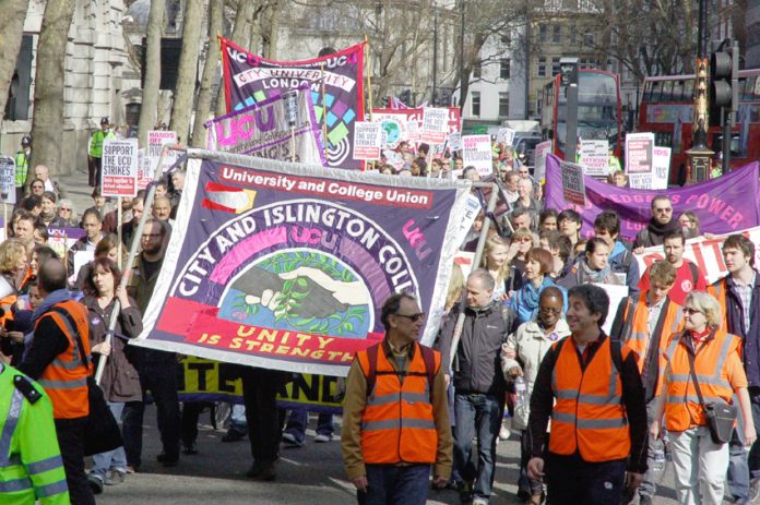 Students march alongside their lecturers on the UCU strike on March 24 this year