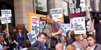 Protesters outside the Culture Committee in July as Rupert Murdoch appeared