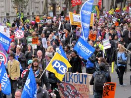 A section of London’s 50,000-strong march with PCS and NASUWT flags