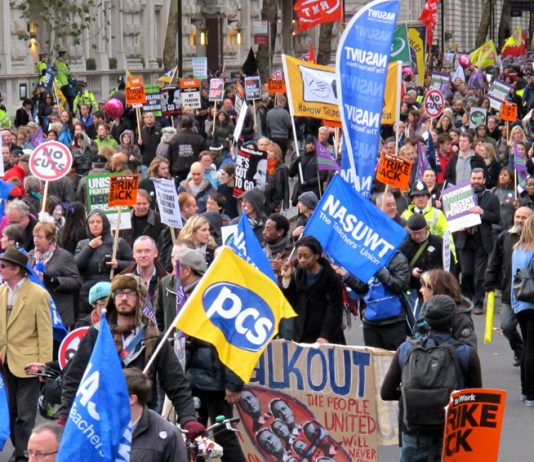 A section of London’s 50,000-strong march with PCS and NASUWT flags