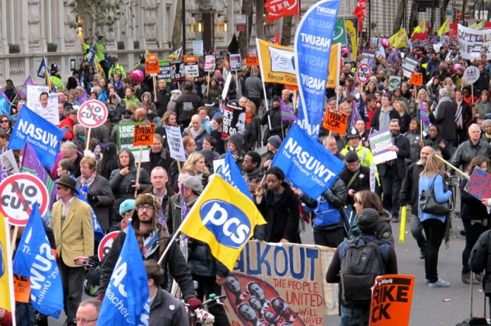 A section of London’s 50,000-strong march with PCS and NASUWT flags