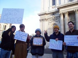 A group of Occupy London campaigners outside St Paul’s Cathedral before their peace walk to Westminster
