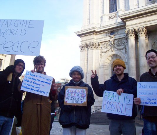 A group of Occupy London campaigners outside St Paul’s Cathedral before their peace walk to Westminster