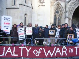 Demonstrators outside the High Court show their support for Julian Assange