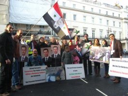 Syrians outside their embassy in London show their support for President Assad and condemn imperialist intervention