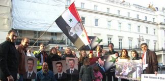 Syrians outside their embassy in London show their support for President Assad and condemn imperialist intervention