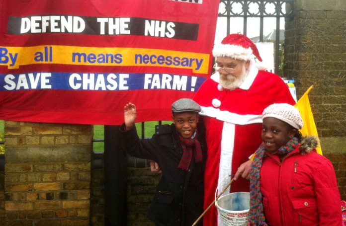 ‘Father Christmas’ with Ethan and Larah Otoo on the picket line at Chase Farm Hospital where both the children were born