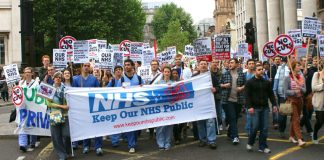 Hospital workers marching last May against the sell-off of NHS services