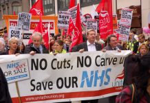Union leaders at the front of a march demanding no cuts and no sell-off of the NHS