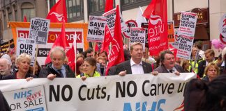 Union leaders at the front of a march demanding no cuts and no sell-off of the NHS