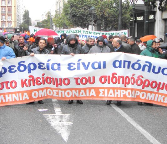 Rail workers marching during Tuesday’s general strike in Athens