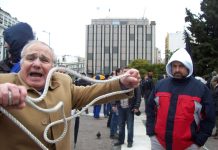 Worker showing the noose he wants to use on the bankers  during a demonstration last Thursday in Athens