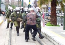 Worker in Athens stands his ground against a riot police attack