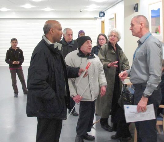 Camden Road surgery patients confront NHS Central London associate director of primary care Tony Hoolighan