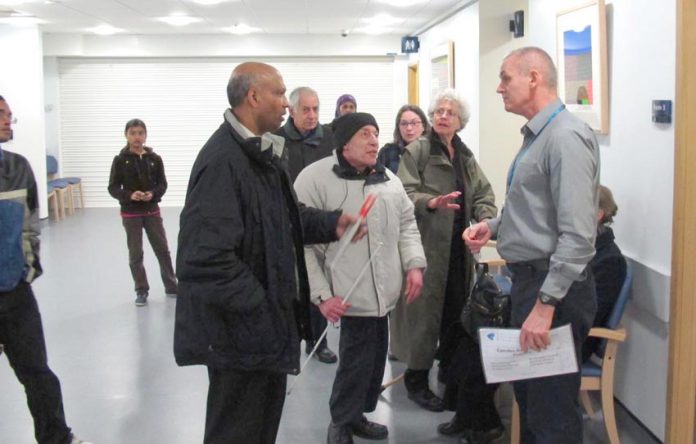 Camden Road surgery patients confront NHS Central London associate director of primary care Tony Hoolighan
