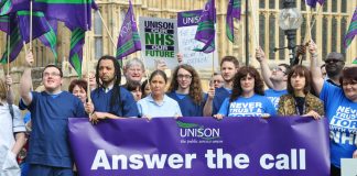 Unison members outside Parliament yesterday afternoon showing their determination to save the NHS