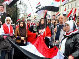 Rally outside the Syrian embassy in London on March 17 commemorates the 27 killed in Damascus that morning by two car bombs