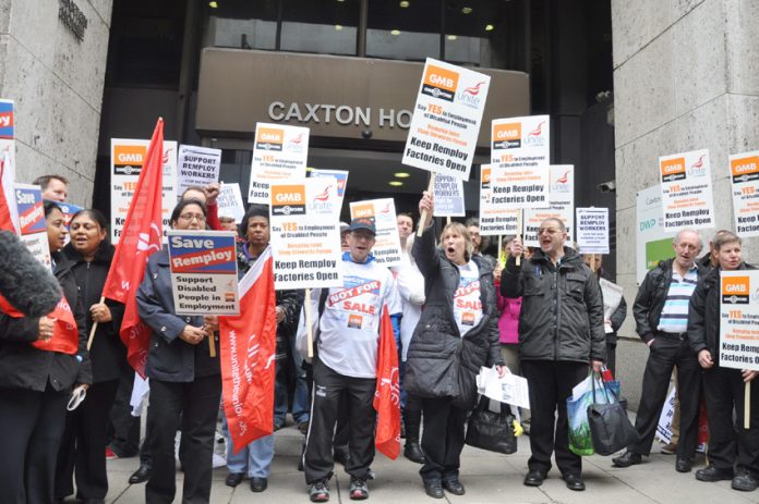 Remploy workers demonstrate outside the Department of Work and Pensions in central London yesterday demanding that their factories be kept open