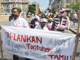 Sri Lanka Assassinations Continue Tamils marching in London on May Day last year depict Sri Lankan Army atrocities
