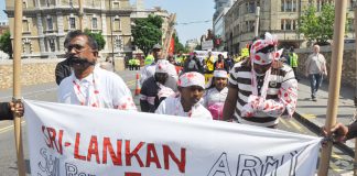Tamils marching in London on May Day last year depict Sri Lankan Army atrocities