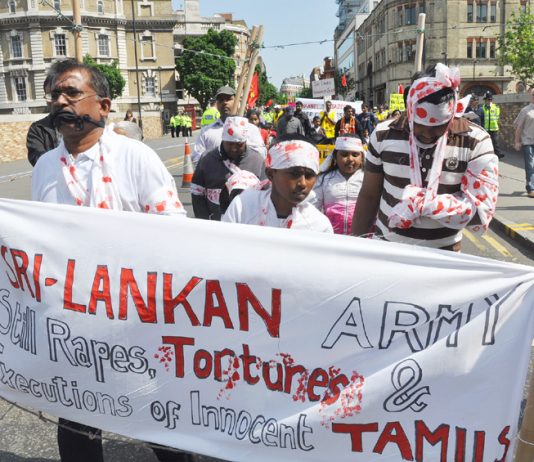 Tamils marching in London on May Day last year depict Sri Lankan Army atrocities